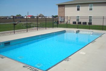 A rectangular blue swimming pool with the words "SAFETY FLOAT" written on the bottom.